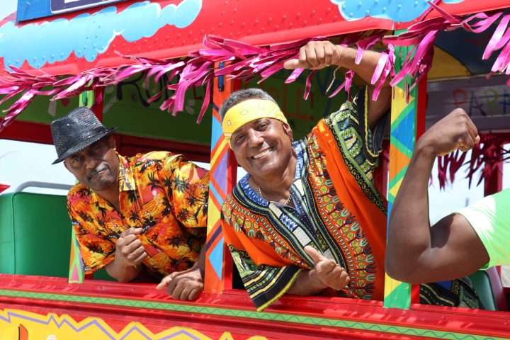 a person holding a colorful kite