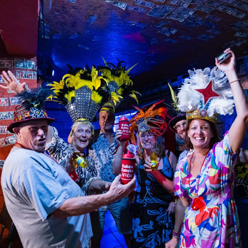 a group of people standing on a stage posing for the camera