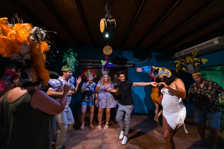 a group of people standing in front of a crowd posing for the camera