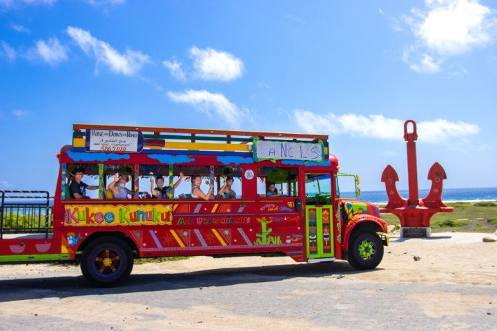 a colorful truck is driving down the road